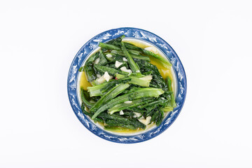 The vegetarian stir-fried romaine lettuce on a white plate of Sichuan cuisine