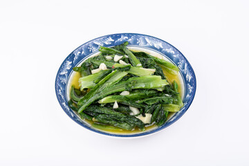 The vegetarian stir-fried romaine lettuce on a white plate of Sichuan cuisine