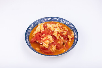 The scrambled eggs with tomatoes on the plate