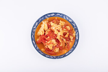 The scrambled eggs with tomatoes on the plate