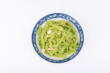 The stir-fried bitter gourd with vegetables on the plate