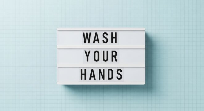 A white lightbox displays the message 'Wash Your Hands' against a light blue background.