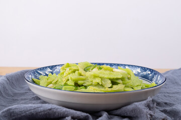 The stir-fried bitter gourd with vegetables on the plate
