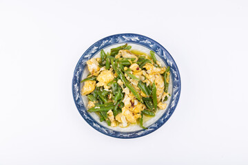 The stir-fried eggs with green peppers on the plate