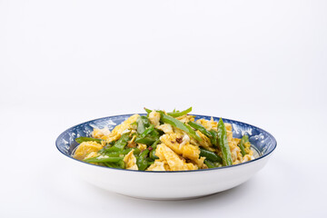 The stir-fried eggs with green peppers on the plate