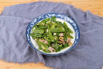 Stir-fried pork with green peppers on the plate