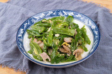 Stir-fried pork with green peppers on the plate