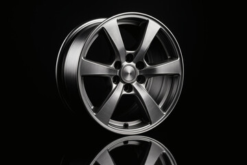 Fototapeta premium Silver Alloy Wheel with Six Spokes on Black Background