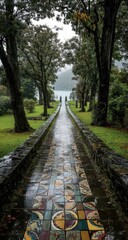 Obraz premium Rainy path through a lush garden, leading to a misty vista