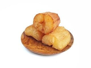 Fried cassava on wooden plate isolated on white background