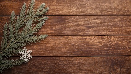 Christmas decoration on wooden background, Retro pine branch and snowflake flat lay.