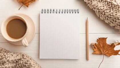 Cozy Autumn Workspace: Blank Notepad Coffee and Knit Sweater Flatlay