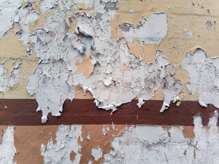 Severy wear, tear and chipping on old building's brick wall