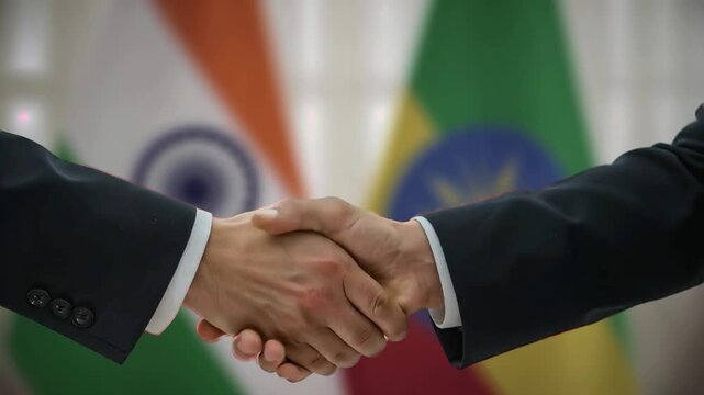 Diplomatic Agreement Symbolized by India Ethiopia Handshake Against Soft Focus Flags