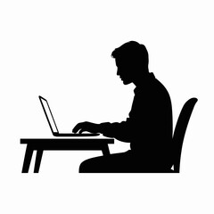 Silhouette of a Man Working on Laptop at Desk