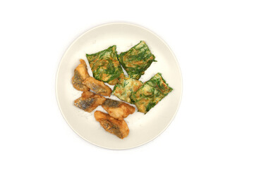 Deep-fried sea bass and fried cha-om leaves