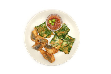 Deep-fried sea bass and cha-om leaves, battered and fried with shrimp paste and eggplant.
