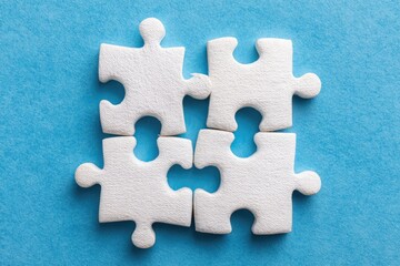 Obraz premium Connected Puzzle Pieces Together On Blue