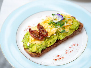 Open sandwich with avocado and egg