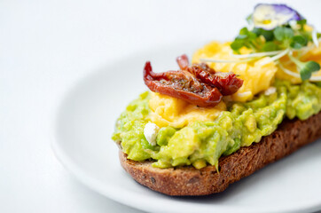 Open sandwich with avocado and egg