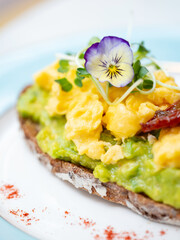 Open sandwich with avocado and egg