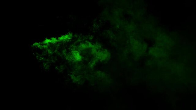 Realistic green smoke mist or fog drifts and swirls on black background. Ideal for overlays, special effects, and creating a mysterious, toxic, poison, radioactive or magical atmosphere
