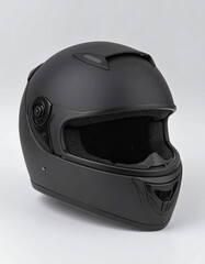Close-up studio shot of a matte black motorcycle helmet, showcasing its design and features.