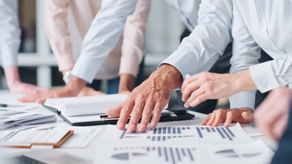 Diverse group of mature professionals engaged in an intense discussion, conveying teamwork and strategic planning, suitable for corporate presentations and team-building events