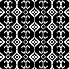 African ethnic tribal fabric pattern is designed in a traditional Ikat style with ethnic black and white tones. The  ethnic contrast creates depth and dimension, giving the fabric a look that is both
