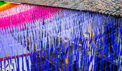 Colorful paper ornaments hanging in a mexican town, celebrating tradition