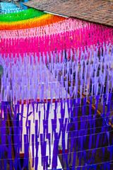 Colorful paper ornaments hanging over street in mexico