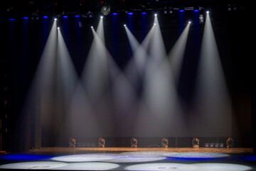 Empty Theater Stage with white Lighting and Spotlights