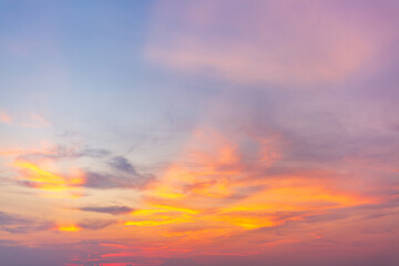 Obraz premium Morning cloud and sky background texture,colorful clouds and sky,Dusk, Sunset Sky Clouds in the Evening with colorful Orange, Yellow, Pink and red sunlight and Dramatic storm clouds on Twilight sky.