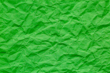 Fototapeta premium Close-up macro crumpled green paper background texture,Paper textured background from crumpled green paper close-up macro photography high detail