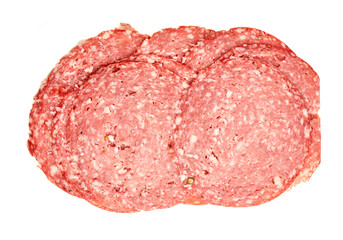 Sliced salami arranged flat to showcase deli meat selection expressing savory convenience and the concept of cured preservation. isolated on white background
