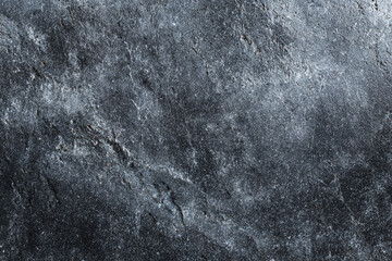 Dark gray textured surface with lighter gray veining and speckles a natural stone look