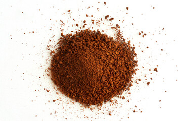 Ground coffee arranged in a wide pile viewed from above isolated on white background
