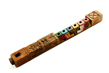Decorative wooden flute captured in perspective isolated on white background
