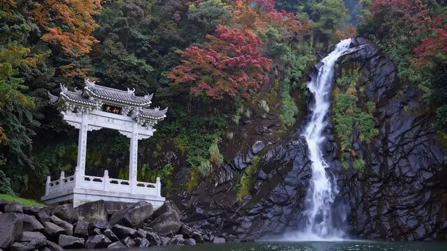 Autumn season in Taiwan at the Changchun shrine accompanied by water cascade within Taroko National Park located in Hualien