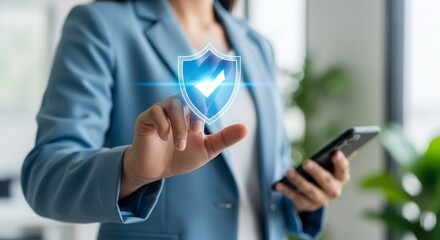 Woman in blue blazer touching digital shield with checkmark while holding phone