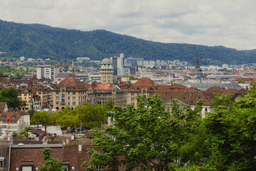 Zurich city panorama with historic buildings and flags