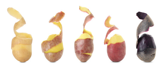Different types of raw potatoes with peels isolated on white, set