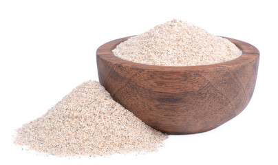Whole aromatic green cardamom pods and ground cardamom powder in a wooden bowl and spoon isolate on a white background. Green cardamom.