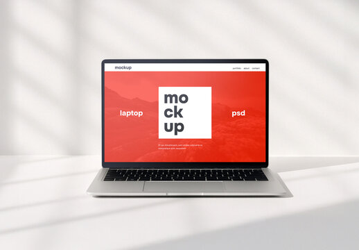 Laptop in clean white environment psd mockup