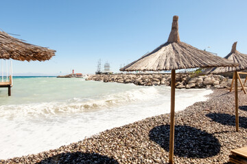 Beach with a few umbrellas and a few people