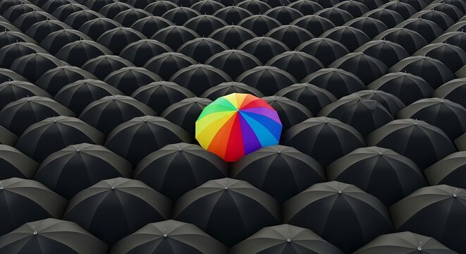 A single vibrant rainbow umbrella stands out among a sea of identical black umbrellas, symbolizing individuality and uniqueness.