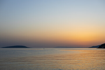Obraz premium Bright sunset over the sea with silhouettes of islands. Adriatic Sea, Makarska Riviera, South Dalmatia, Croatia