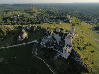 Golden hour drone flight over Olsztyn Castle, Poland