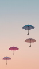 Obraz premium Minimalist pastel umbrellas floating gracefully above horizon glowing faintly against muted pastel gradient sky of spring
