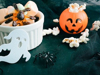Halloween decoration with popcorn candy on a dark background